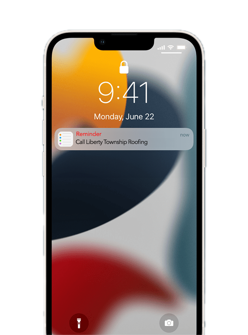 a iPhone lock screen displaying a reminder to call roofing company after work.