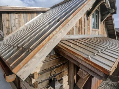close up of metal roof. image of a corrugated roof also known as exposed fastener.